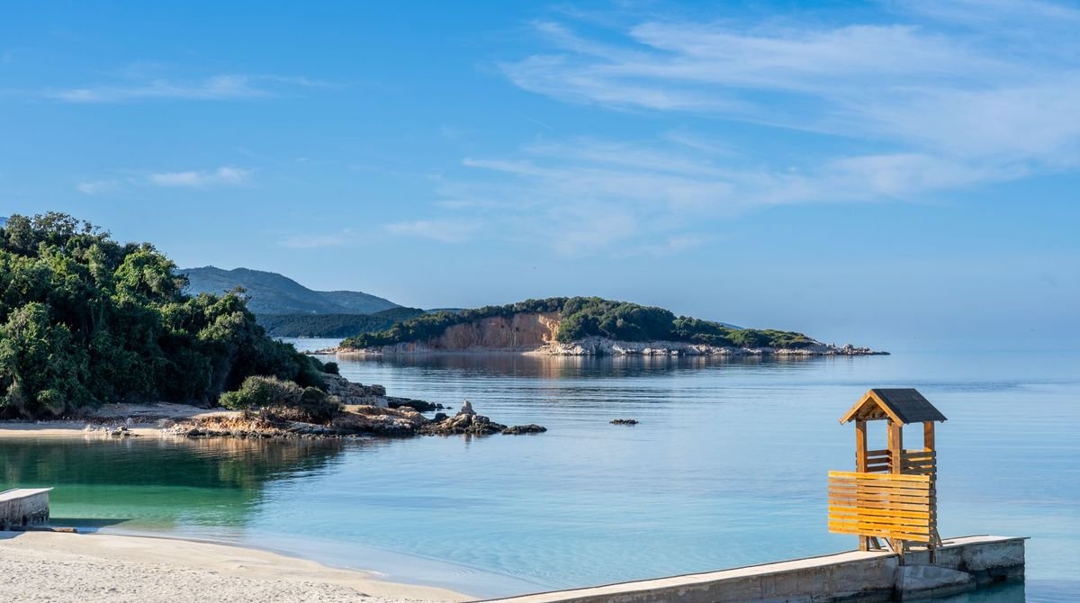 Turquoise water and small islands off the beach at Ksamil, Albania