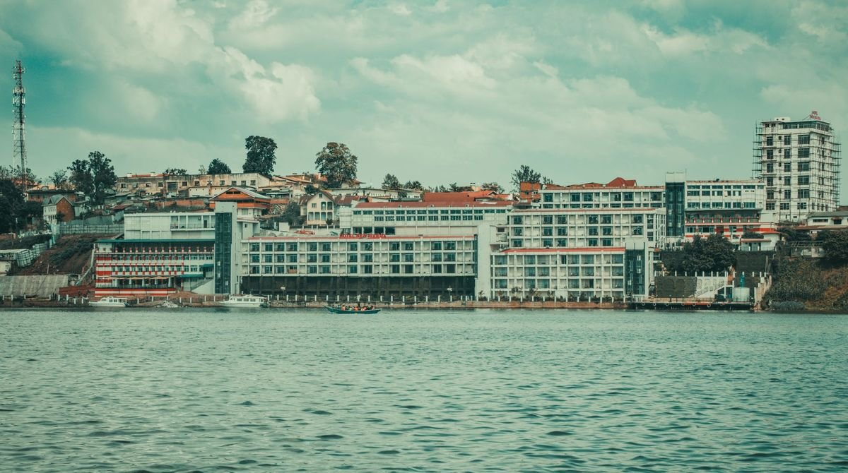 Lakeside buildings under a cloudy sky in the Democratic Republic of the Congo