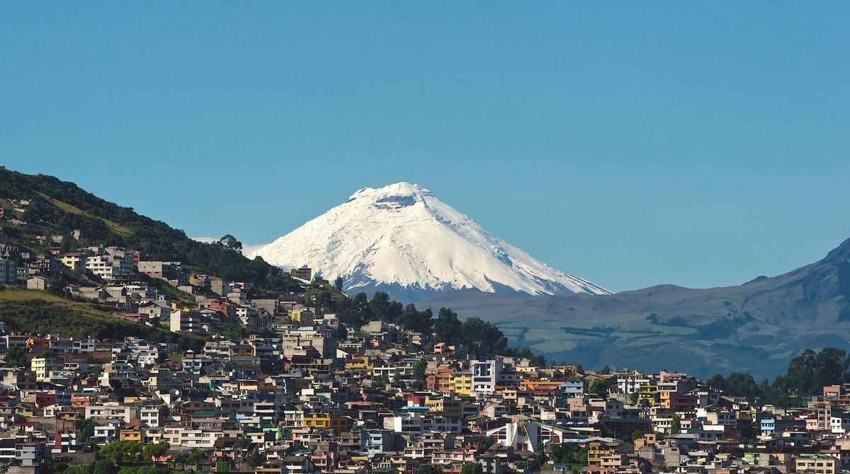 Snow-capped volcano above the hills of Quito, Ecuador