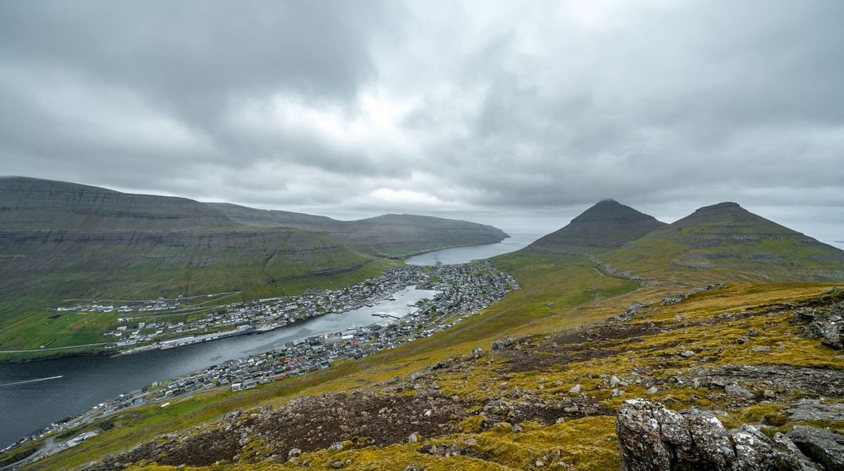 Green mountains and a fjord in the Faroe Islands