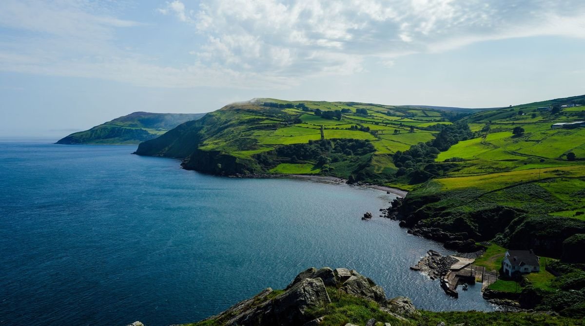 Green hills and cliffs above the sea on the Isle of Man