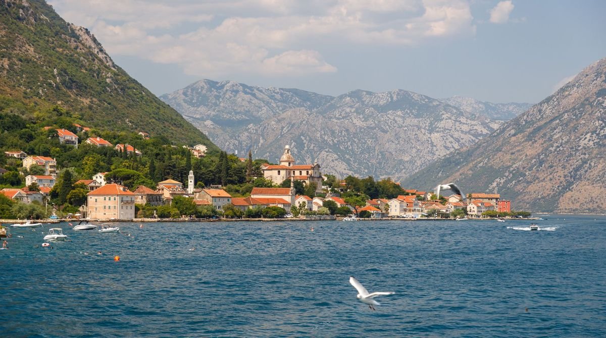 Small stone town on the Bay of Kotor below the mountains, Montenegro