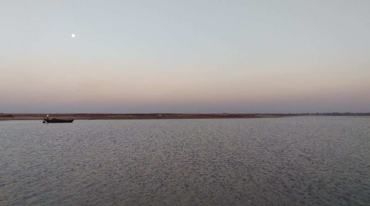 Calm wide river at dusk in the Sahel