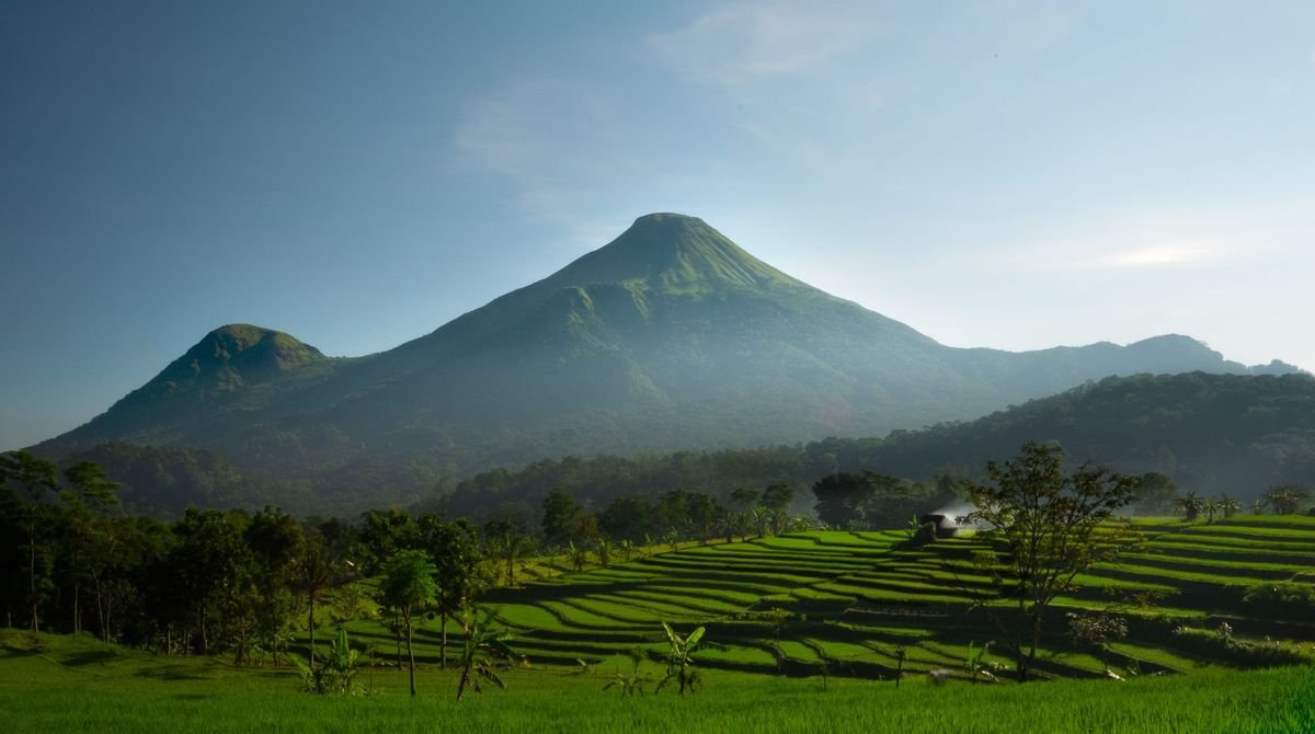 Green hills below a volcano in northern Rwanda