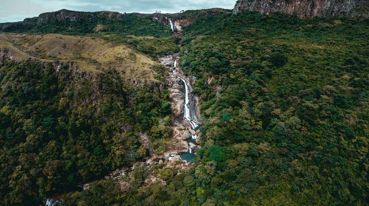 Waterfall in green forested hills in Togo